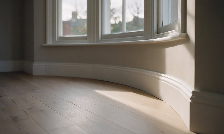 Flexible MDF skirting board following the curve of a period bay window
